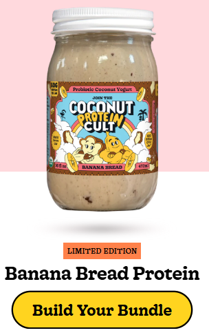 Minimalist glass jar of The Coconut Cult probiotic coconut yogurt placed on a natural kitchen surface